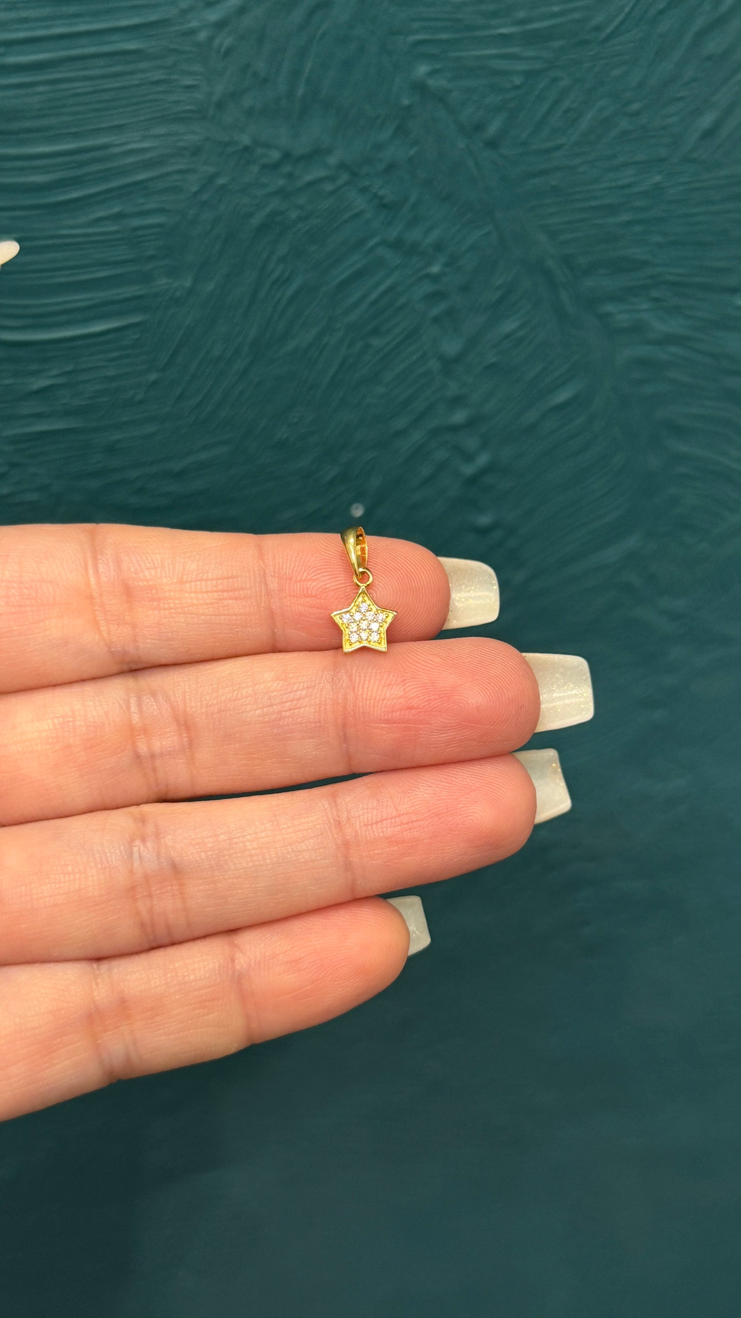 dije estrella / 0.6 gr